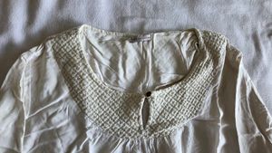 Elegant White Top with Textured Yoke