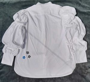 White balloon-sleeve shirt.