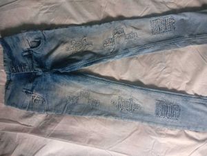 Distressed Blue Denim Jeans