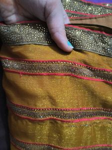 Elegant mustard heavy party wear saree with blouse
