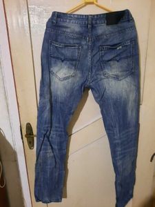 2 numbers of Distressed Blue Jeans