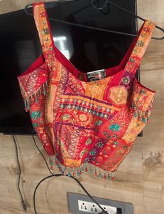 Red plazzo with stone work multi colour top