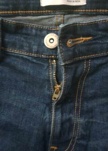 Distressed Blue Denim Jeans