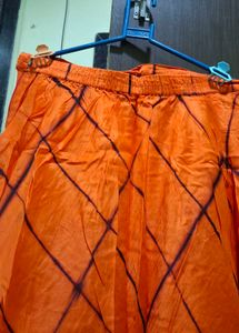 Vibrant Orange Ethnic Skirt with Tie-Dye Pattern