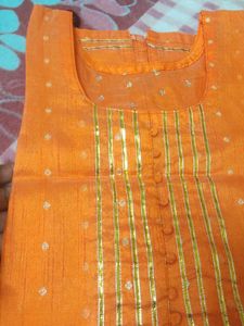 Vibrant Orange Kurta with Gold Embellishments