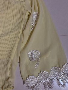 Yellow Pleated Blouse with Silver Embellishments