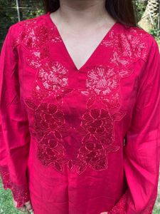 Beautiful Red Coords Set with price tag.