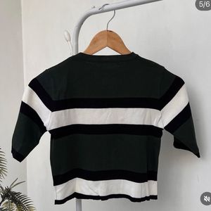 Green and White printed top.