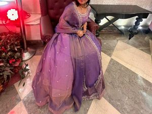 Tissue Lehenga with stiched blouse