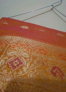 Elegant Orange Saree with Intricate Border
