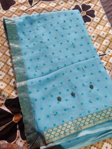 A Nice Sky Blue Saree With Beads