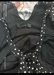 Stylish black and white polkadot top