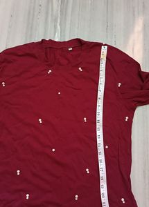 It's New Unused Maroon Coloured T Shirt.