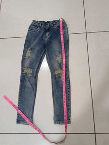 Distressed Blue Denim Jeans