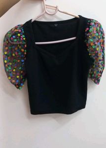 Chic Black Top with Polka Dot Puff Sleeves