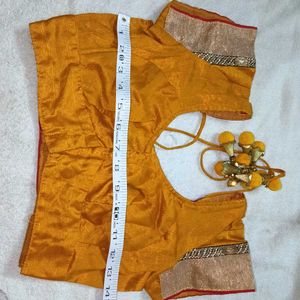 mustard yellow colour blouse with heavy latkan.
