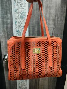 Chic Orange Laser-Cut Handbag