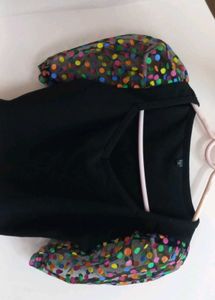 Chic Black Top with Polka Dot Puff Sleeves
