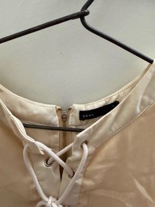 Cream Lace-Up Tiered Sleeveless Top