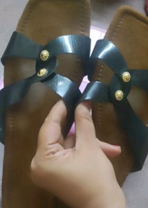 Brown and black strapped flat