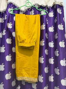 Elegant Yellow Kurti pant with Intricate Neckline