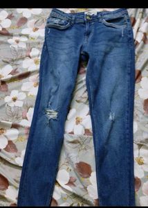 Distressed Blue Denim Jeans