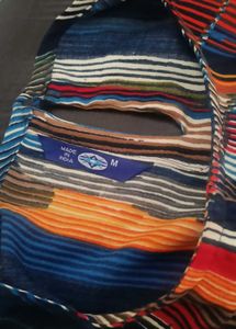 Vibrant Striped Blouse with Tassel Trim