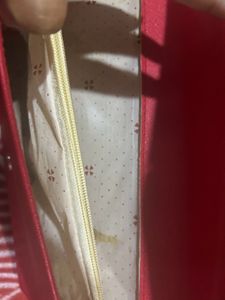 Red Sling Bag With CHANEL Logo