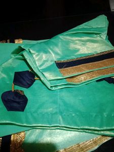 Stunning Teal Saree with Gold Border