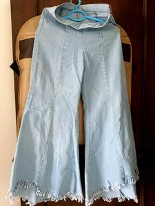 Light Wash Bell Bottom Jeans with Fringed Hem