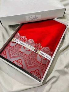 Vibrant Red Silk Saree with Intricate Silver Borde