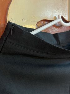 Black button skirt, looks chic