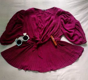 A beautiful decent purple top with florry sleeves