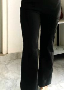 Chic Black Flared Pants with Subtle Stripe Detail