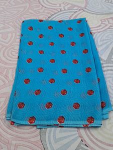 Blue Saree With Red And Some White Dots.