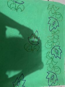 A Light Green Saree With Hand Work