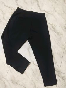 casual comfortable black trouser and cotton top.