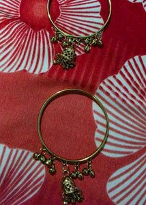 Set of 4 Gold Tone Bangles with Charms