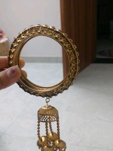 Elegant Gold Tone Bangle with Tassel