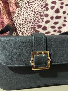 Chic Black Crossbody Bag with Gold Buckle