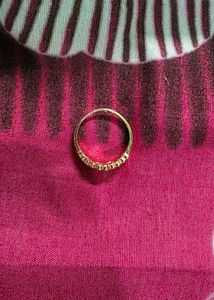 Delicate Gold Ring with Subtle Embellishments