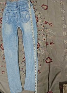 Light Wash Distressed Jeans with Pearl Detail