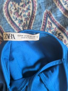 zara blue body suit with mesh panel