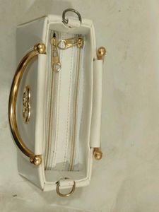Elegant Cream Handbag with Gold Accents