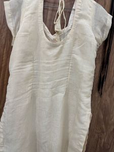an elegant, cream-toned traditional Indian Kurta