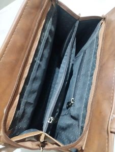 Chic Brown Handbag with Embellished Handle