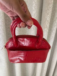 glossy red mini handbag