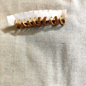 Set of 5 pair golden stone stdded huggie hoops.