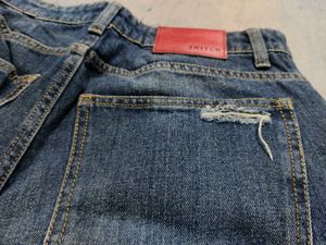 Distressed Blue Denim Jeans