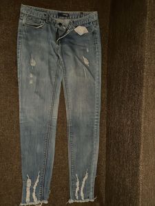 Distressed Blue Denim Jeans